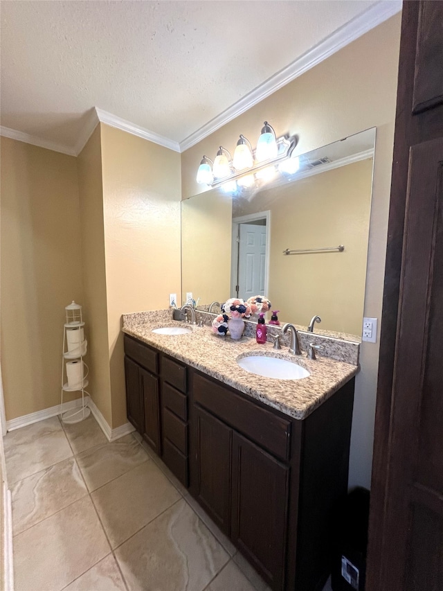 bathroom with ornamental molding, a textured ceiling, vanity, and tile patterned floors