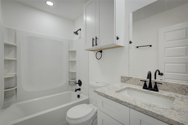 full bathroom featuring vanity, bathtub / shower combination, and toilet