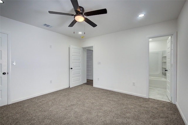 unfurnished bedroom featuring carpet flooring, connected bathroom, and ceiling fan