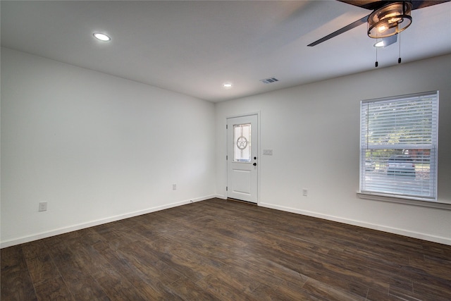 unfurnished room with ceiling fan and dark hardwood / wood-style floors