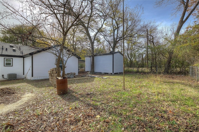 view of yard featuring central air condition unit