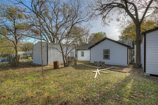 back of house with a yard