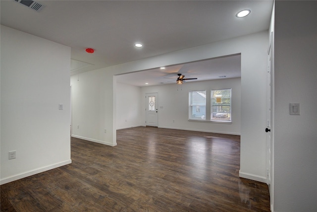 spare room with dark hardwood / wood-style floors and ceiling fan