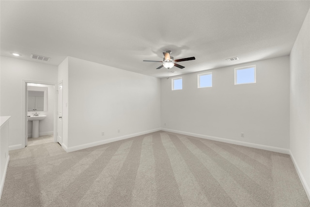 5009 Tamarack Ln, Royse City, TX 75189 - unfurnished room with a ceiling fan, light carpet, baseboards, and a sink