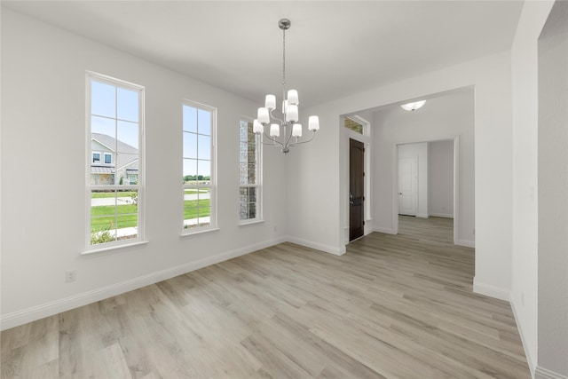 5009 Tamarack Ln, Royse City, TX 75189 - unfurnished dining area featuring plenty of natural light, a chandelier, and light wood-style flooring