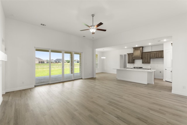 5009 Tamarack Ln, Royse City, TX 75189 - unfurnished living room featuring ceiling fan, light wood finished floors, baseboards, and recessed lighting