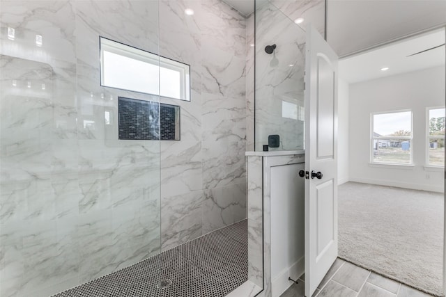 bathroom with a tile shower