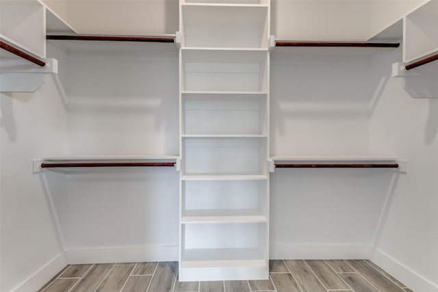 walk in closet featuring light hardwood / wood-style floors