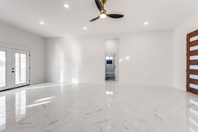 interior space with french doors and ceiling fan