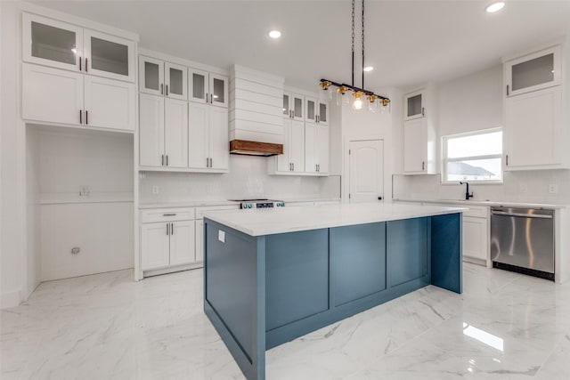 kitchen featuring dishwasher, hanging light fixtures, a center island, tasteful backsplash, and white cabinets