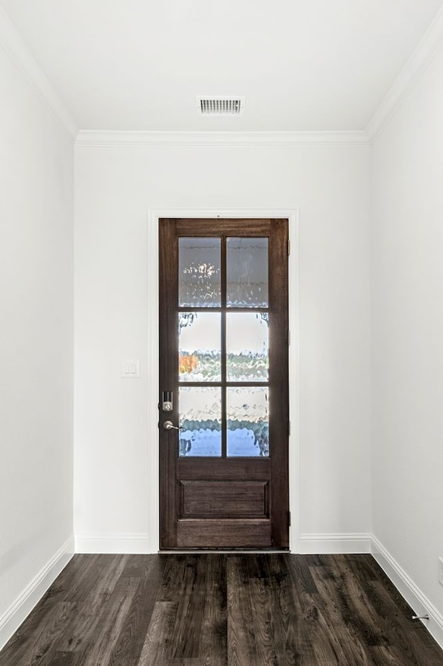 foyer with dark hardwood / wood-style flooring and crown molding