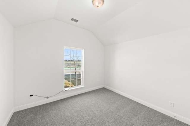 bonus room with carpet and vaulted ceiling