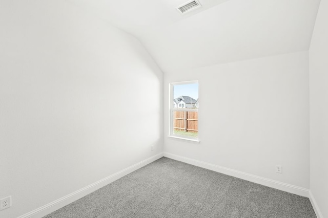 bonus room with carpet floors and vaulted ceiling