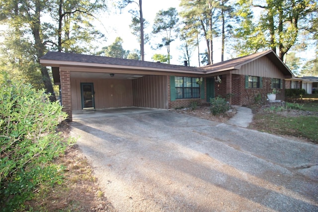 single story home featuring a carport