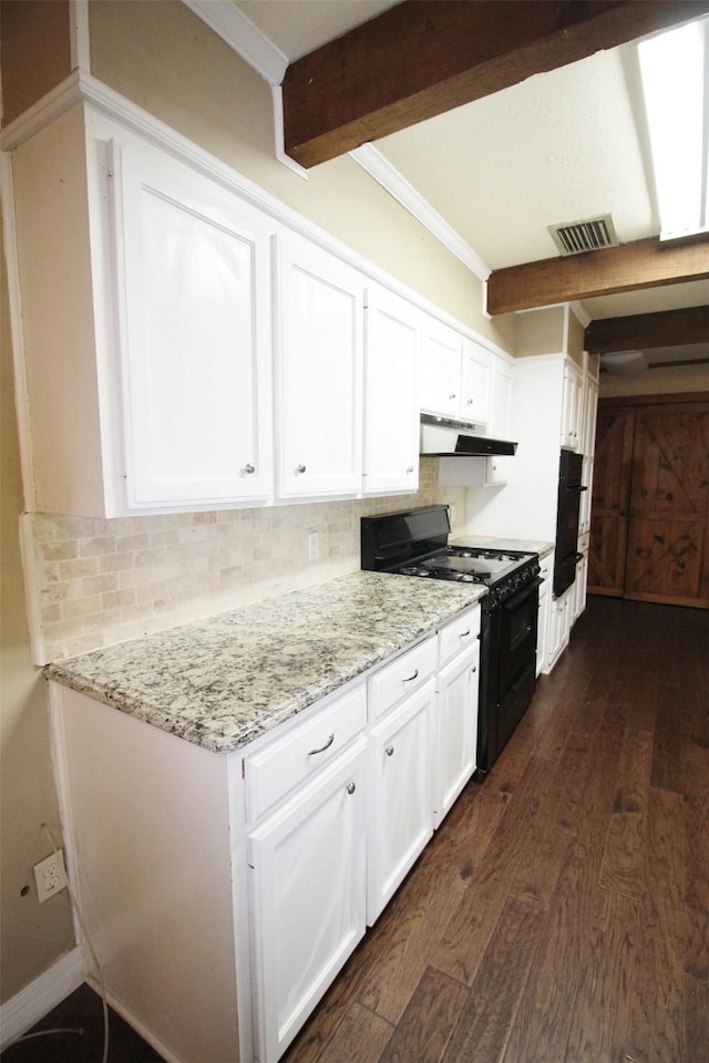 kitchen with white cabinets, dark hardwood / wood-style flooring, and black gas range oven