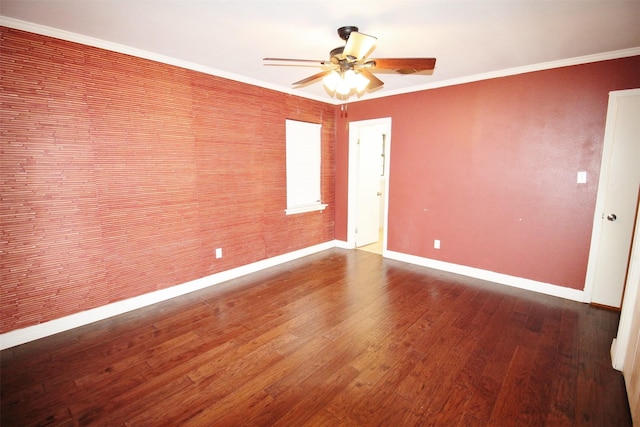 empty room with crown molding, hardwood / wood-style floors, and ceiling fan