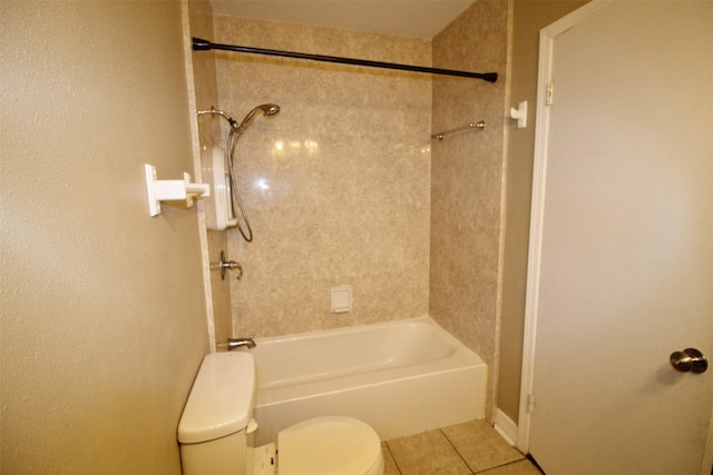 bathroom featuring tile patterned flooring, toilet, and shower / bathtub combination