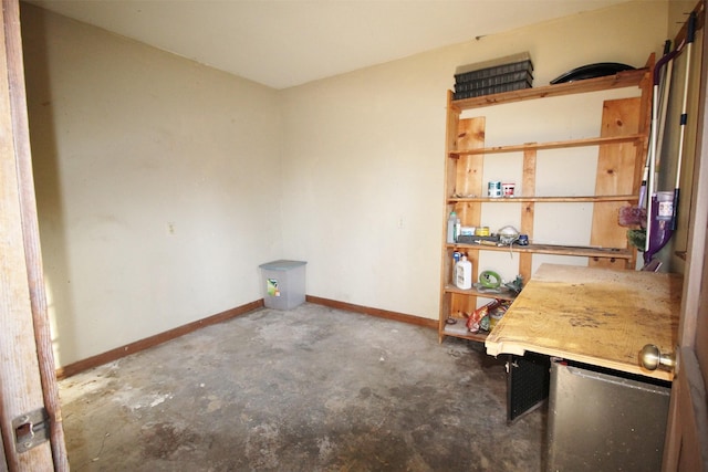 unfurnished office featuring concrete flooring