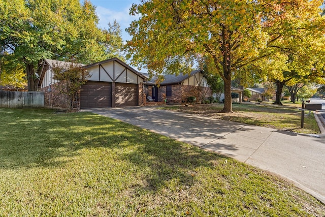 view of front of house featuring a front yard and a garage