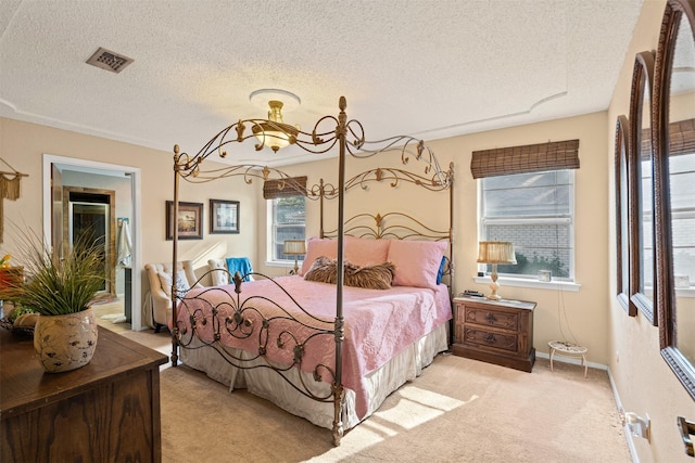 bedroom featuring light carpet, a textured ceiling, an inviting chandelier, and multiple windows