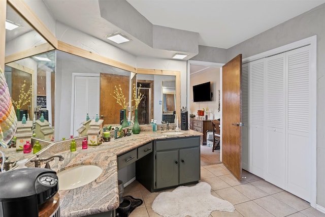 bathroom with tile patterned flooring and vanity