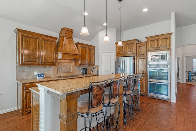 dining room with dark hardwood / wood-style flooring, vaulted ceiling, a healthy amount of sunlight, and a notable chandelier