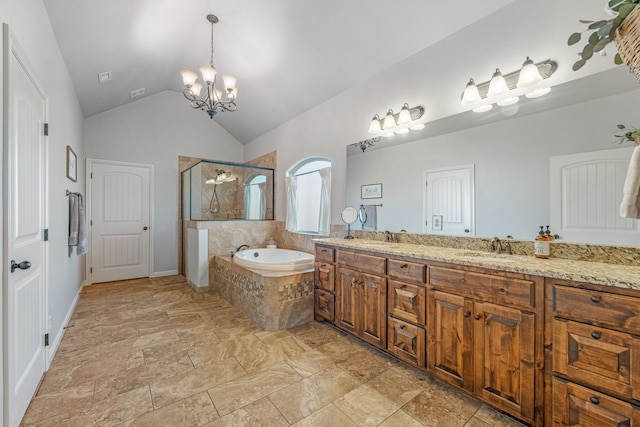 bathroom with vanity, a relaxing tiled tub, and high vaulted ceiling