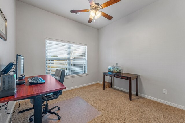 carpeted bedroom with ceiling fan and high vaulted ceiling