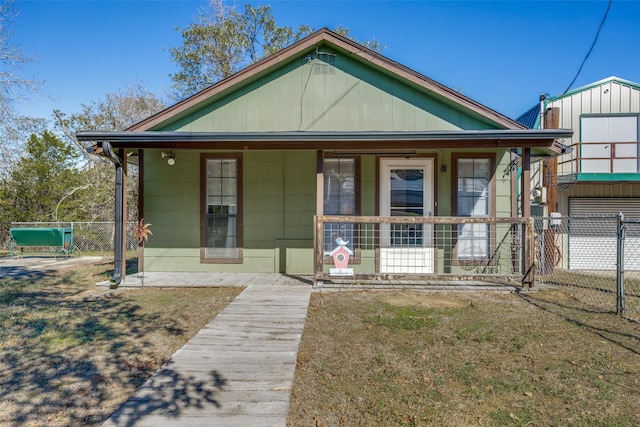 bungalow-style home featuring a front yard and a porch