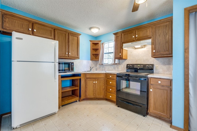 kitchen with black appliances, sink, ceiling fan, a textured ceiling, and tasteful backsplash