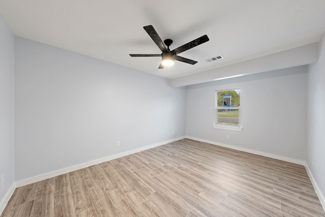 spare room featuring light hardwood / wood-style flooring and ceiling fan