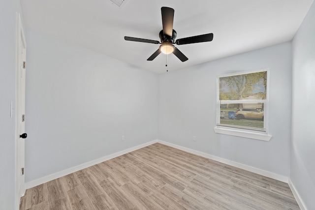 spare room with ceiling fan and light hardwood / wood-style flooring