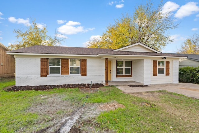 ranch-style house with a front yard and a porch