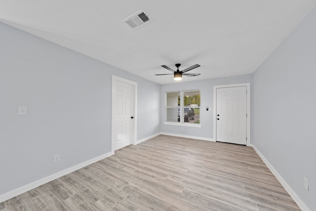 spare room with ceiling fan and light hardwood / wood-style floors