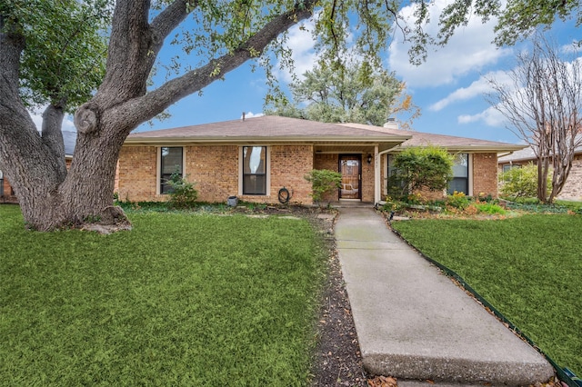 ranch-style house with a front lawn