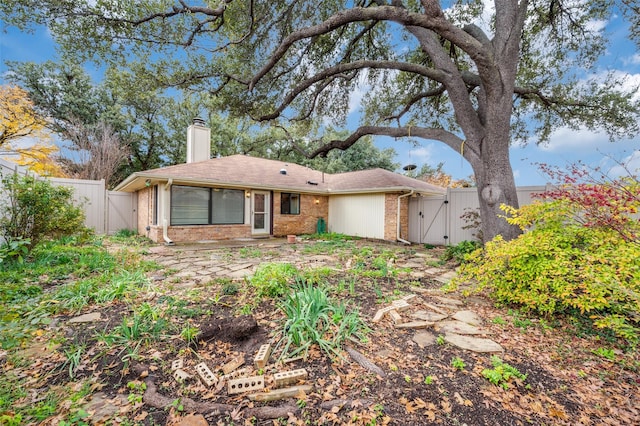 rear view of house with a patio