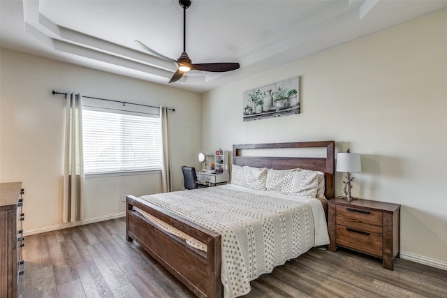 bedroom with ceiling fan and dark hardwood / wood-style flooring