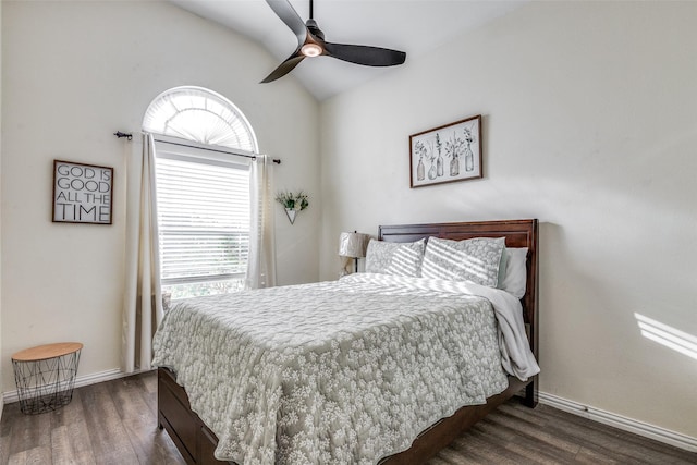 bedroom featuring dark hardwood / wood-style flooring, lofted ceiling, and ceiling fan