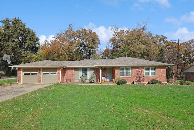 ranch-style home featuring a garage and a front lawn