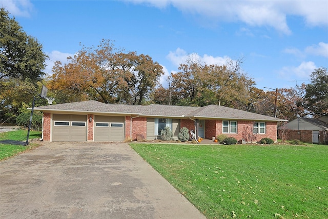 ranch-style house with a front yard and a garage