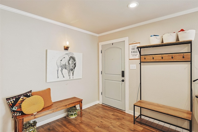 mudroom with wood-type flooring and crown molding