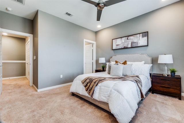 bedroom with ceiling fan and light carpet