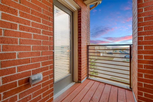 view of balcony at dusk