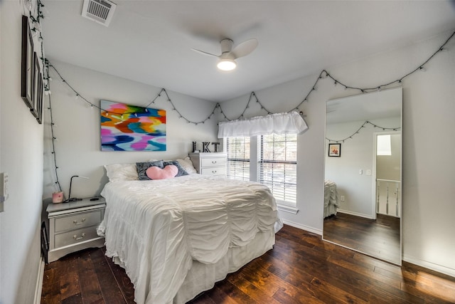 bedroom featuring ceiling fan and dark hardwood / wood-style floors