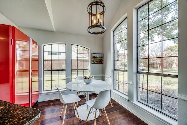 dining space with dark wood-type flooring