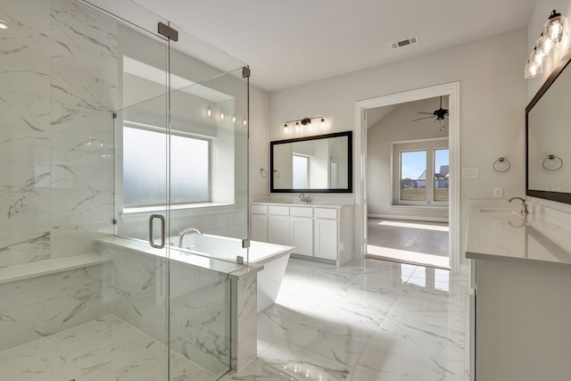 bathroom with ceiling fan, a shower with door, and vanity