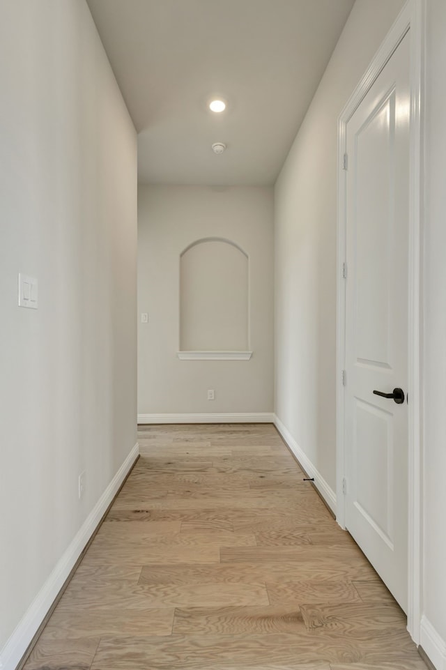 hall with light hardwood / wood-style floors