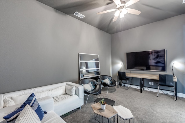 carpeted living room featuring ceiling fan