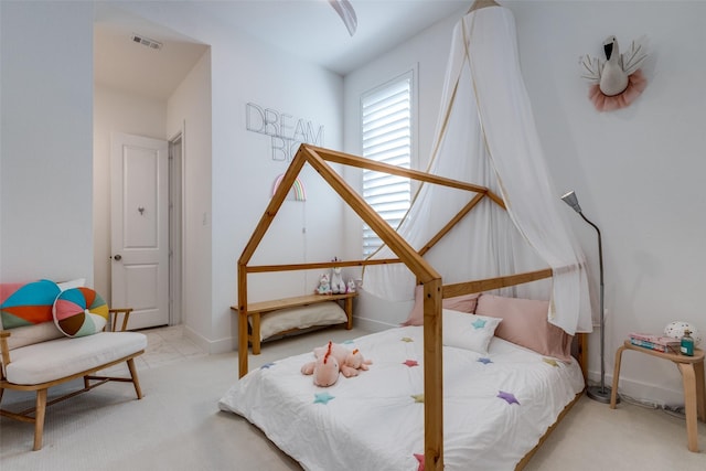 bedroom with light colored carpet