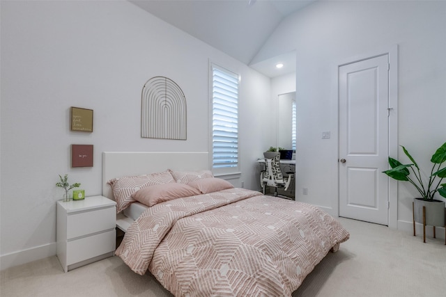 carpeted bedroom featuring vaulted ceiling